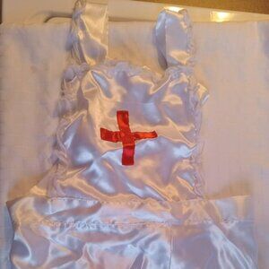 Costume with nurse's apron, cap, and red bow